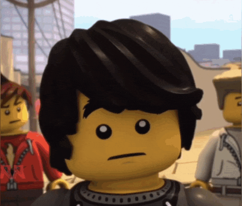 a close up of a lego figure with a serious face