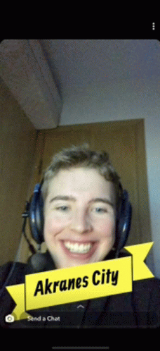 a young man wearing headphones with a yellow ribbon that says akrane city