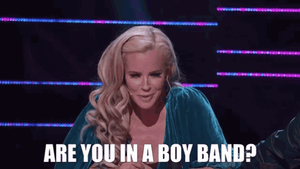 a woman in a blue velvet dress is asking if she is in a boy band