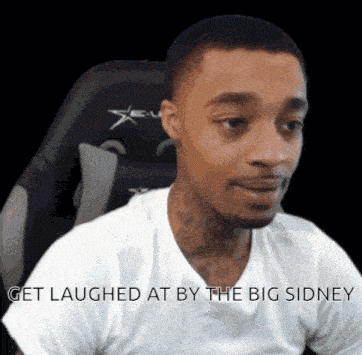 a man in a white shirt is sitting in a chair with the words get laughed at by the big sidney above him