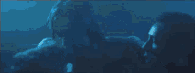 a blurry picture of a man in a dark room