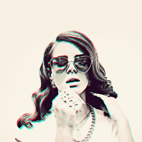 a blurry picture of a woman wearing sunglasses and a choker