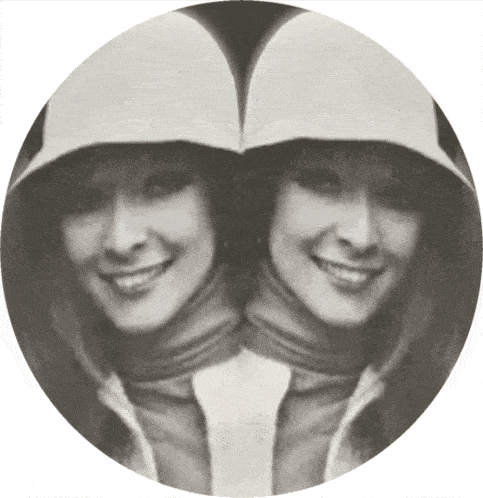 a black and white photo of a woman with two faces