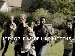 a group of zombies are running through a field .