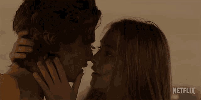 a man and a woman are kissing in a netflix advertisement