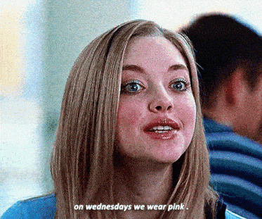 a woman says " on wednesdays we wear pink " in a blurry photo