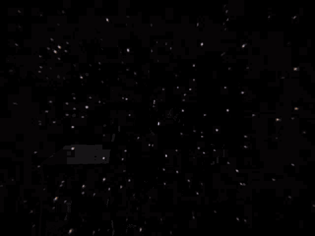 a person is typing on an old typewriter in a dark room