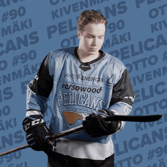 a pelican 's hockey player is holding a stick