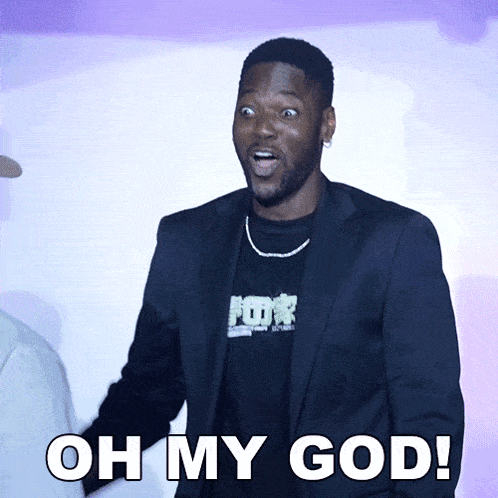 a man in a suit says oh my god in front of a purple wall