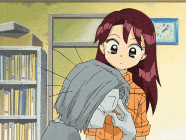 a girl with red hair stands next to a clock that shows the time as 9:05