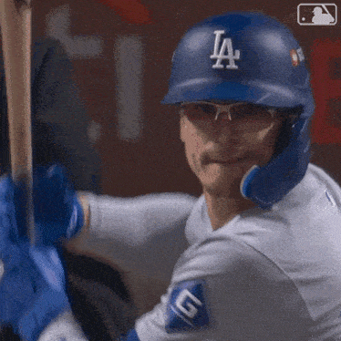 a baseball player wearing a helmet with the letter la on it