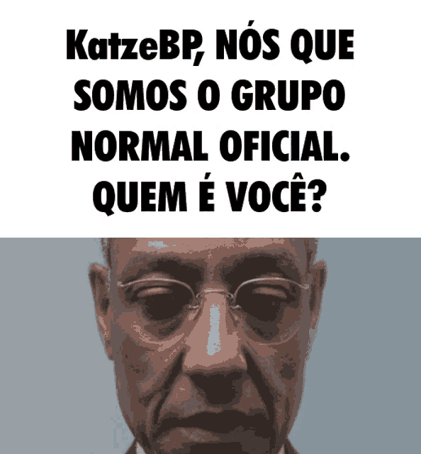 a man with glasses is behind a sign that says katzebp