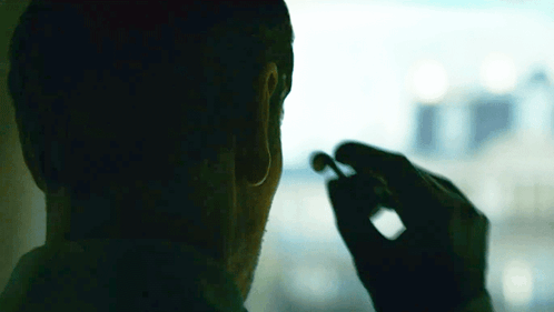 Wearing Earbuds The Killer GIF - Wearing Earbuds The Killer Michael Fassbender GIFs