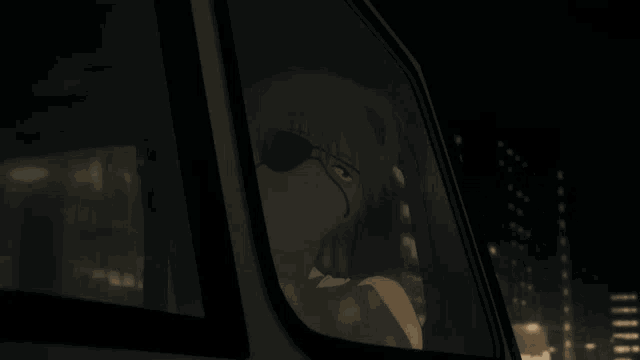 a man wearing an eye patch looks out of a car window at night