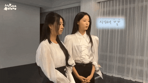 two women are standing next to each other in front of a sign that says " milk witch "
