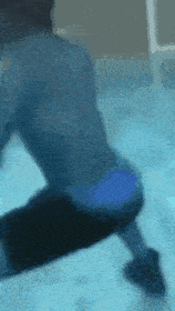 a blurry image of a person in a blue bikini