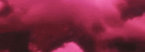 a close up of pink clouds in the sky