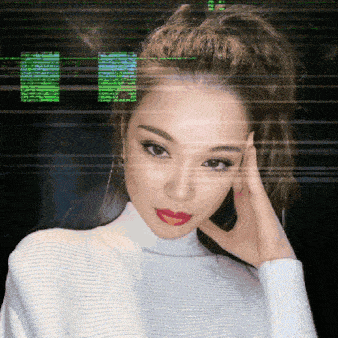 a woman wearing a white turtleneck sweater with red lips