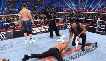 a wrestling ring with a sign that says " elimination chamber " on it