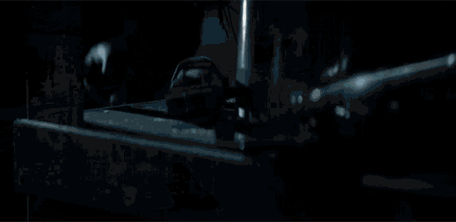 a glowing light is coming out of the ground in the dark