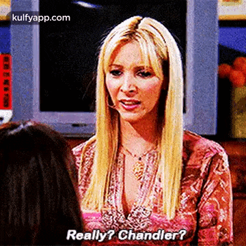 a woman is talking to another woman while wearing a headset and asking , `` really ? chandler ? ''