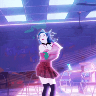 a woman in a plaid skirt is dancing in a room with the word titan on the ceiling