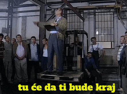 a man standing on a pallet with the words tu ce da ti bude kraj written above him
