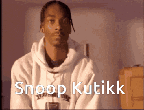 a man in a white hoodie with the words snoop kutikk on the bottom