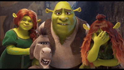 a group of shrek characters posing for a photo