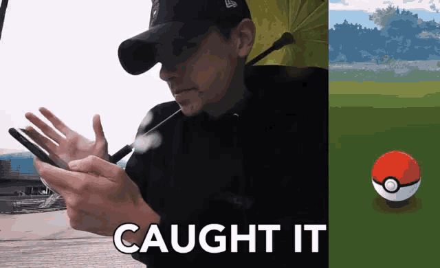 a man holding an umbrella next to a pokemon ball that says caught it on it
