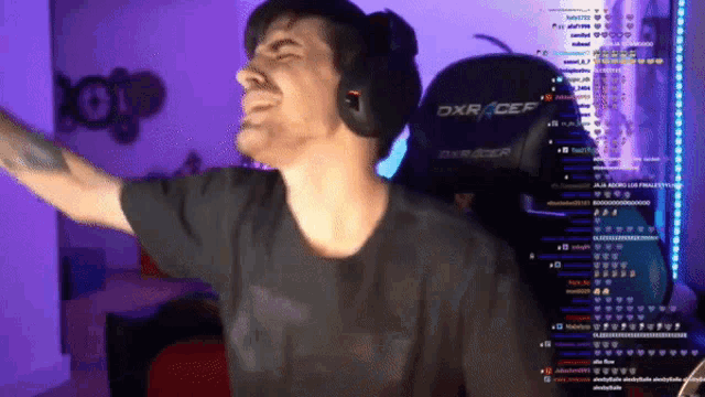 a man wearing headphones and a shirt that says dxr cef