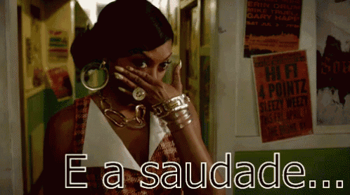 a woman is talking on a cell phone and the words e a saudade are above her