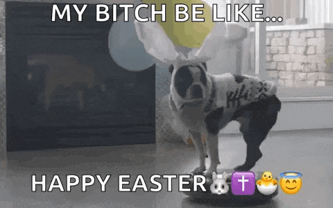 a dog is wearing a bunny costume and holding a balloon while standing next to a fireplace .