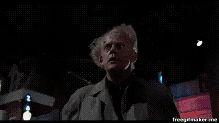 a man in front of a sign that says hill valley star
