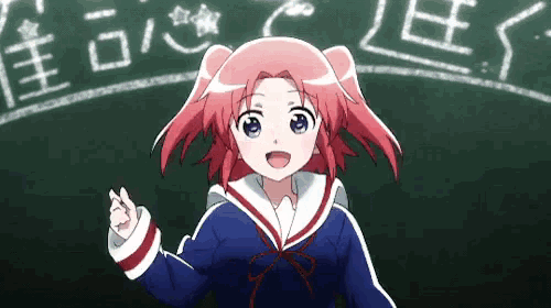 a girl with red hair and blue eyes is standing in front of a blackboard with chinese writing on it .