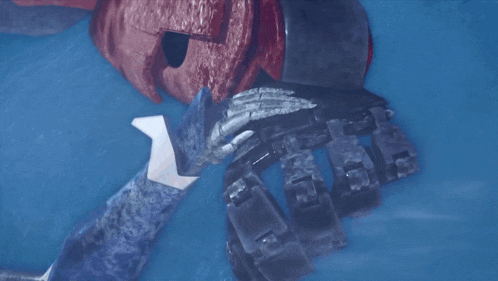 a robotic arm is laying in the water next to a pirate helmet