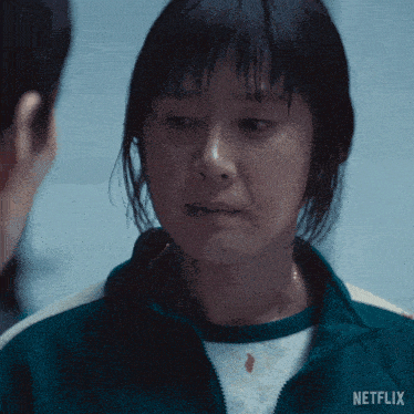 a close up of a woman 's face with netflix written on the bottom