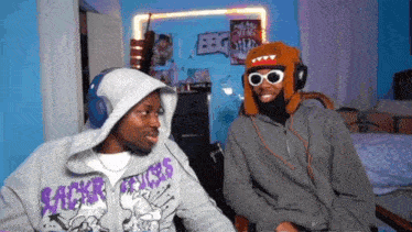 a man wearing a hoodie that says sacker venges