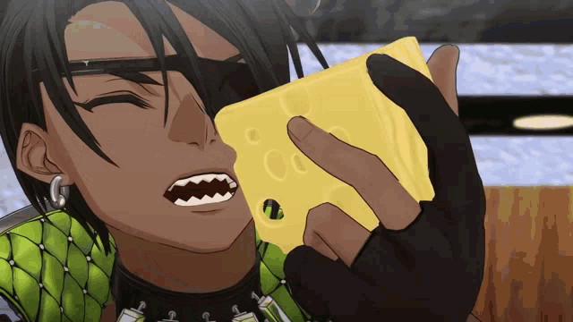 a man is holding a slice of cheese in front of his face