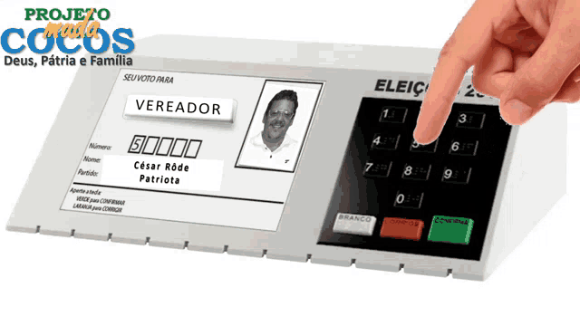 a person pressing a button on a machine that says vereador