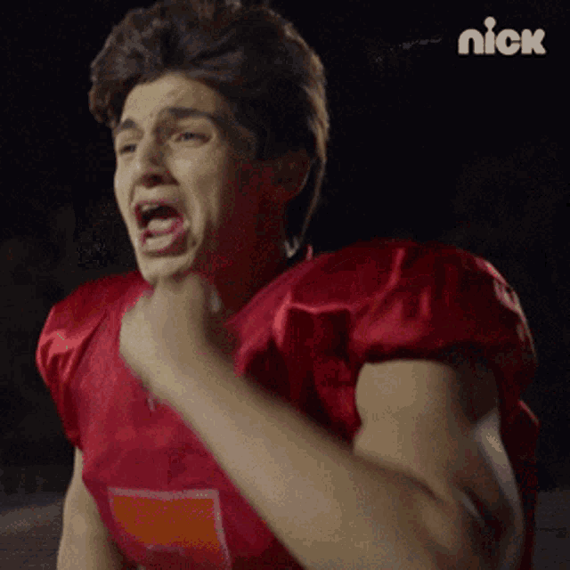 a football player in a red jersey with the number 7 on the front
