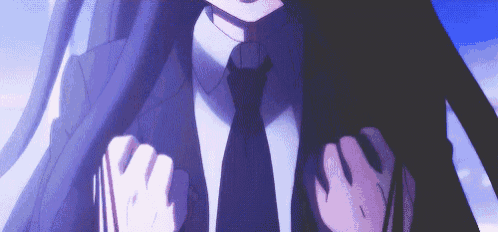a close up of a person in a suit and tie