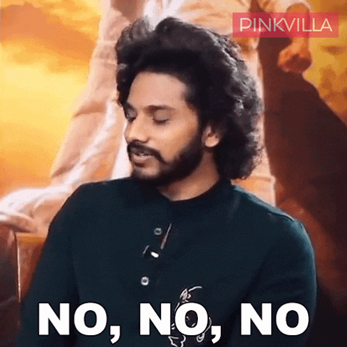 a man with curly hair and a beard is saying no no no