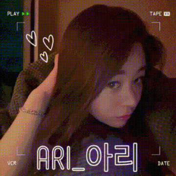 a woman 's face is being recorded on a tape with the name ari written on it