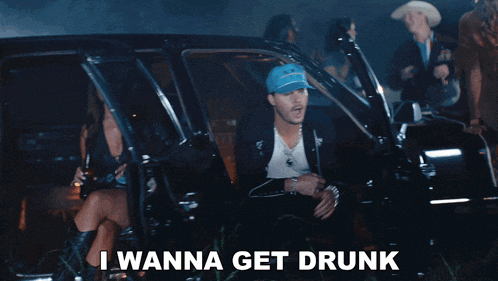a man in a suit and tie is standing next to another man with the words i wanna get drunk on the bottom