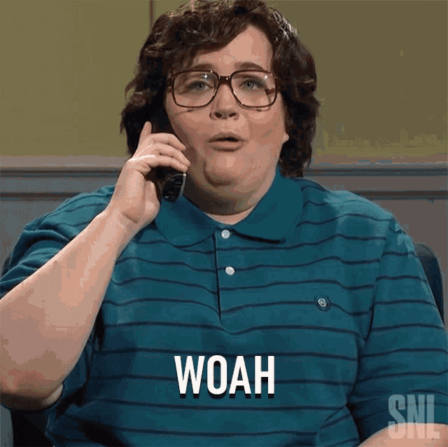 a woman talking on a cell phone and the word woah is on the screen