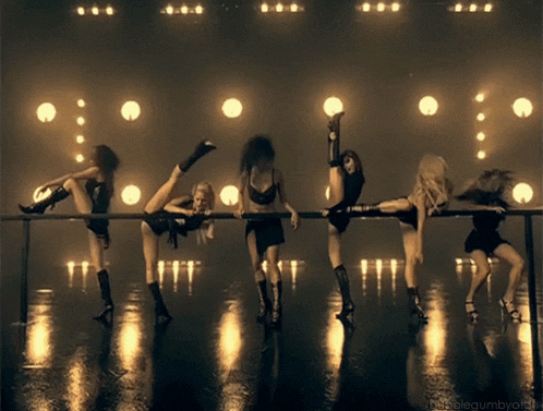 a group of women are dancing in a dark room and the words bubblegumbyoffii are on the bottom right