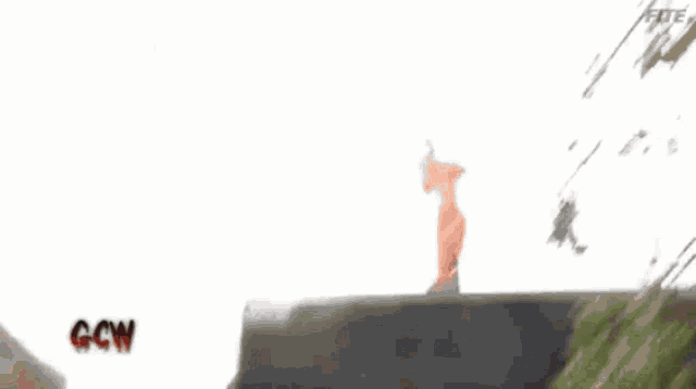 a man is doing a handstand on a wall with a sign that says ccm on it