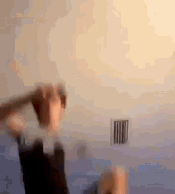 a blurry photo of a person holding a fork