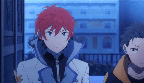 a boy with red hair and blue eyes is standing next to another boy